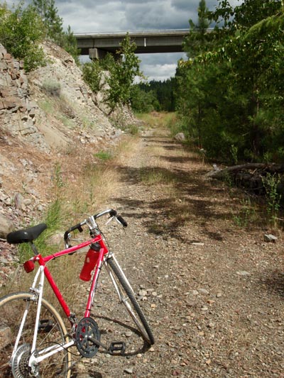 Abandon railroad bed trail with bicycle.