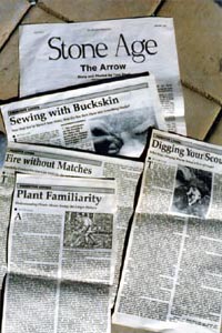 Newspapers with stone age and nature articles.