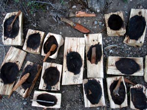 Coal burned out wood bowls.