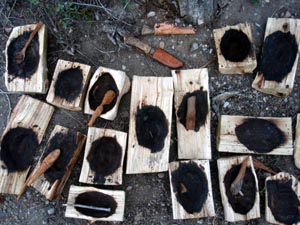 Coal burned out wood bowls.